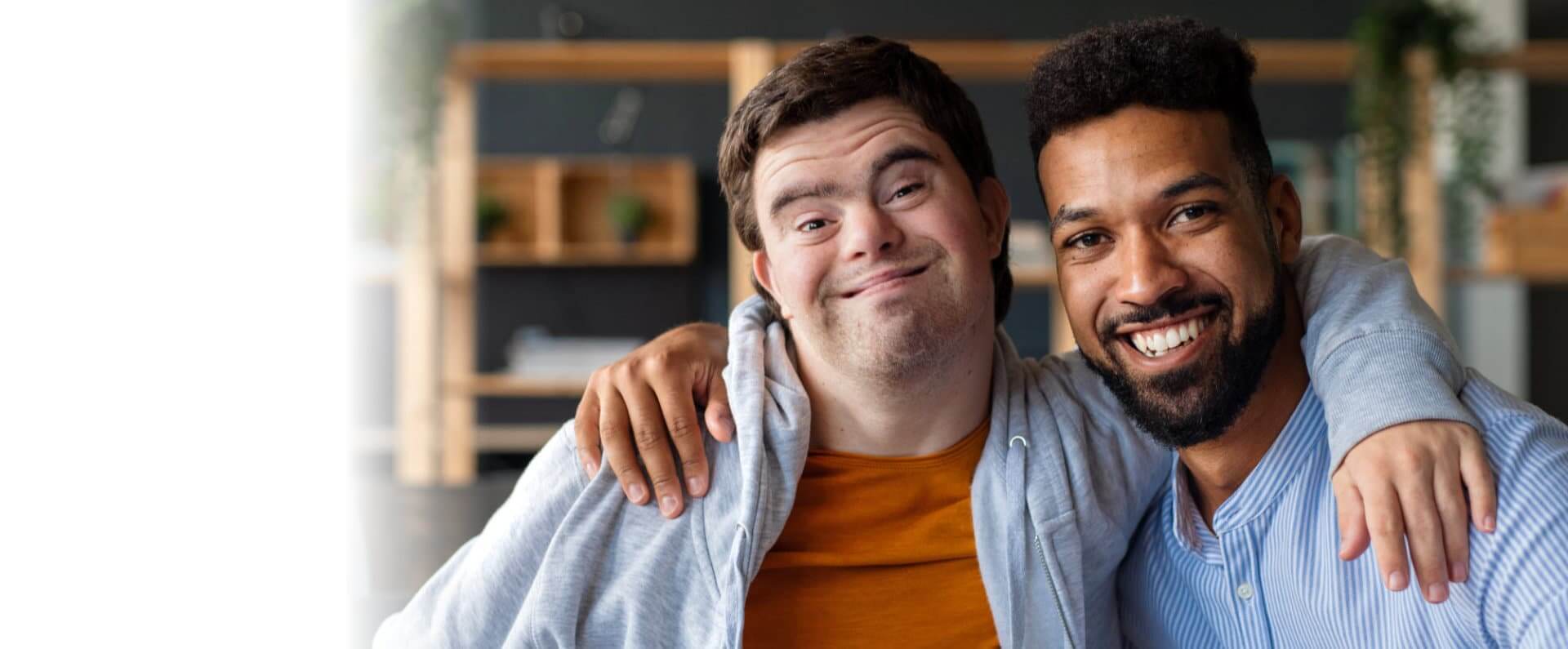 Young man with Down syndrome and his tutor